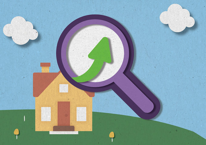 An illustration of a house with a magnifying glass near it.